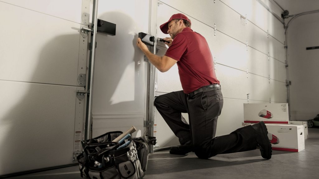 A technician performing commercial lock maintenance