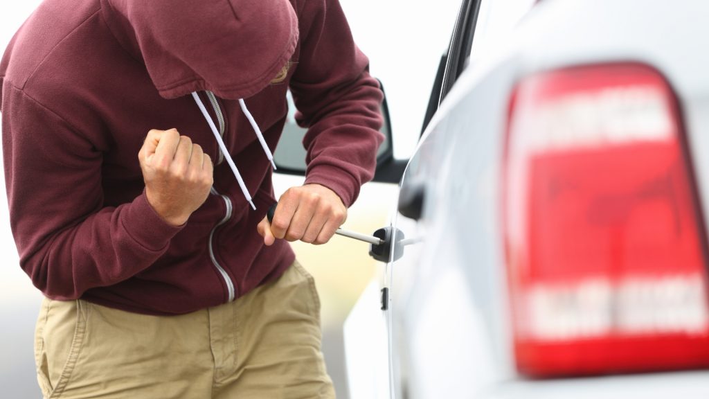 A theft attempting to pry open auto locks