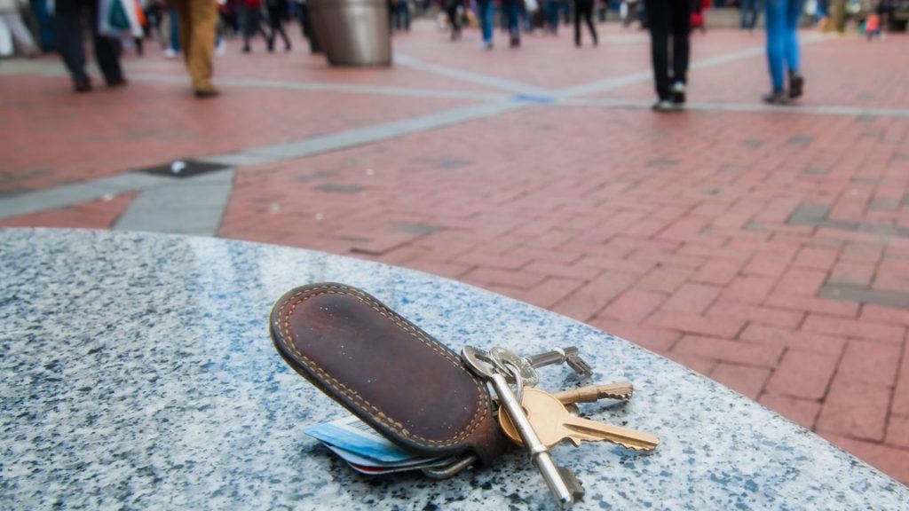 A set of keys on top of an outdoor table